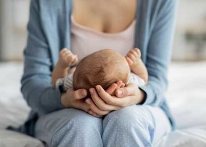 A newborn baby on mother's lap