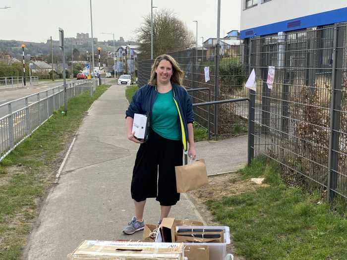 Charlotte holding laptops